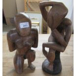 Two carved fruitwood tribal figures  18" & 16"h