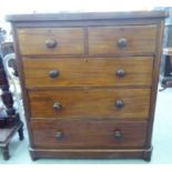 A late Victorian mahogany veneered four drawer dressing chest, on a plinth  45"h  40"w