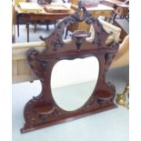 A late Victorian carved mahogany overmantel mirror  52"h  52"w overall