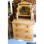 An early/mid 20thC bleached pine, four drawer dressing chest, surmounted by a pivoting mirror, on