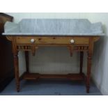 An early 20thC washstand, the drop-in galleried marble top raised on a pine underframe  34"h  41"w
