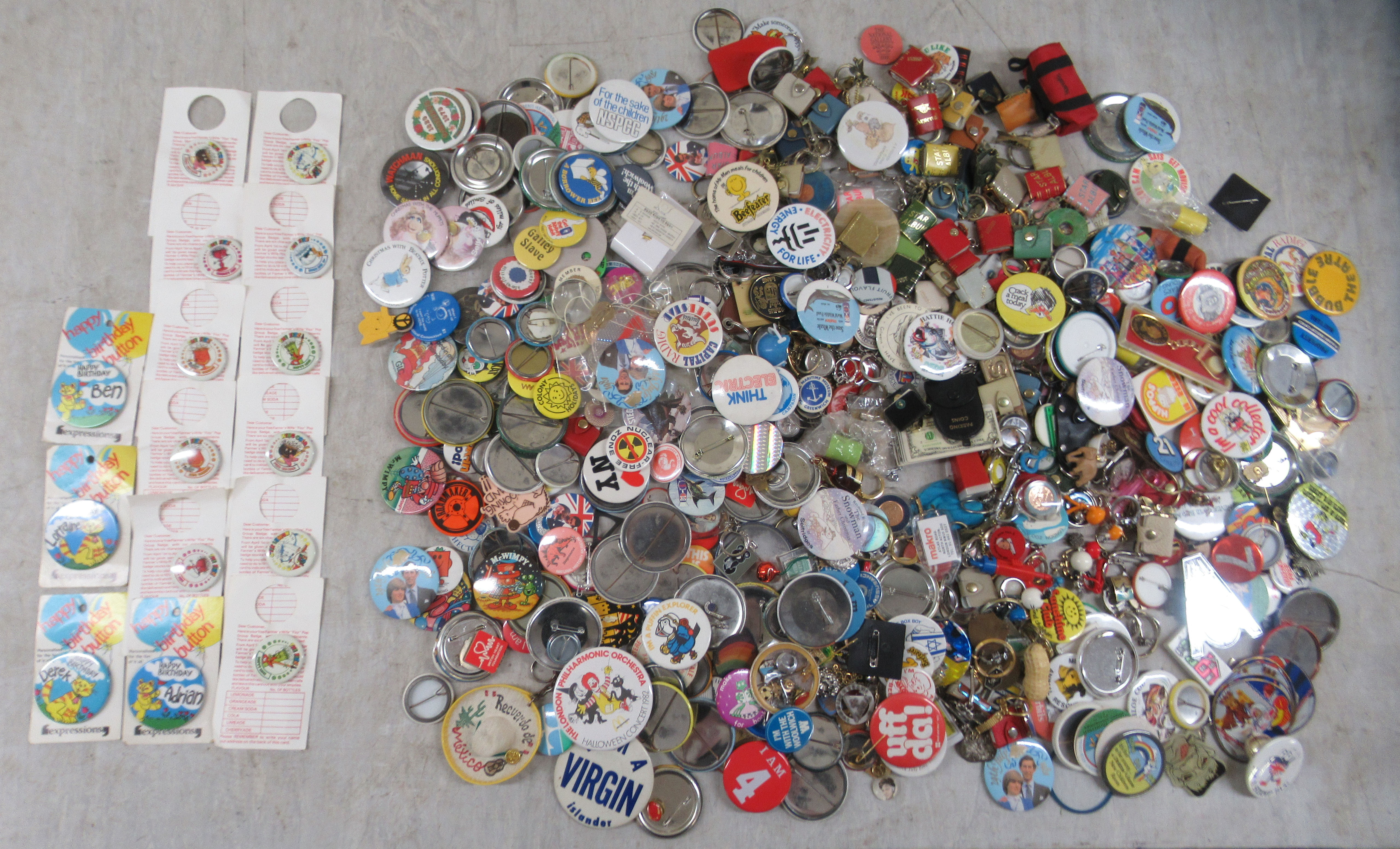 A collection of variously themed badges and keyrings