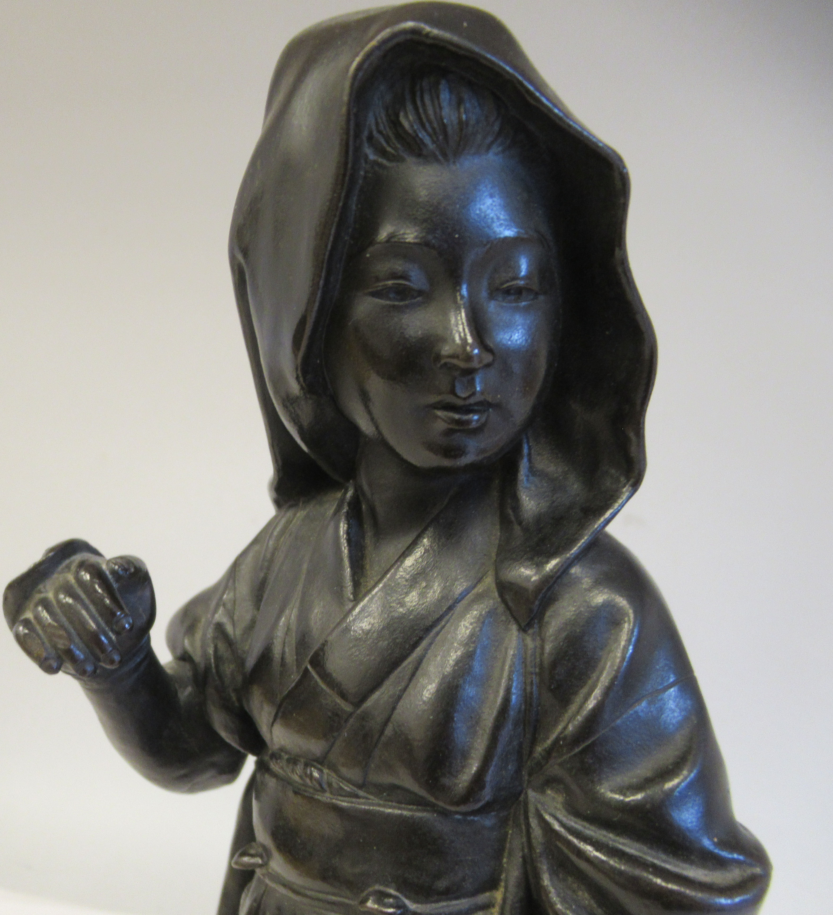 A late 19thC cast and patinated bronze figure, a young woman wearing traditional dress, walking with - Image 2 of 6