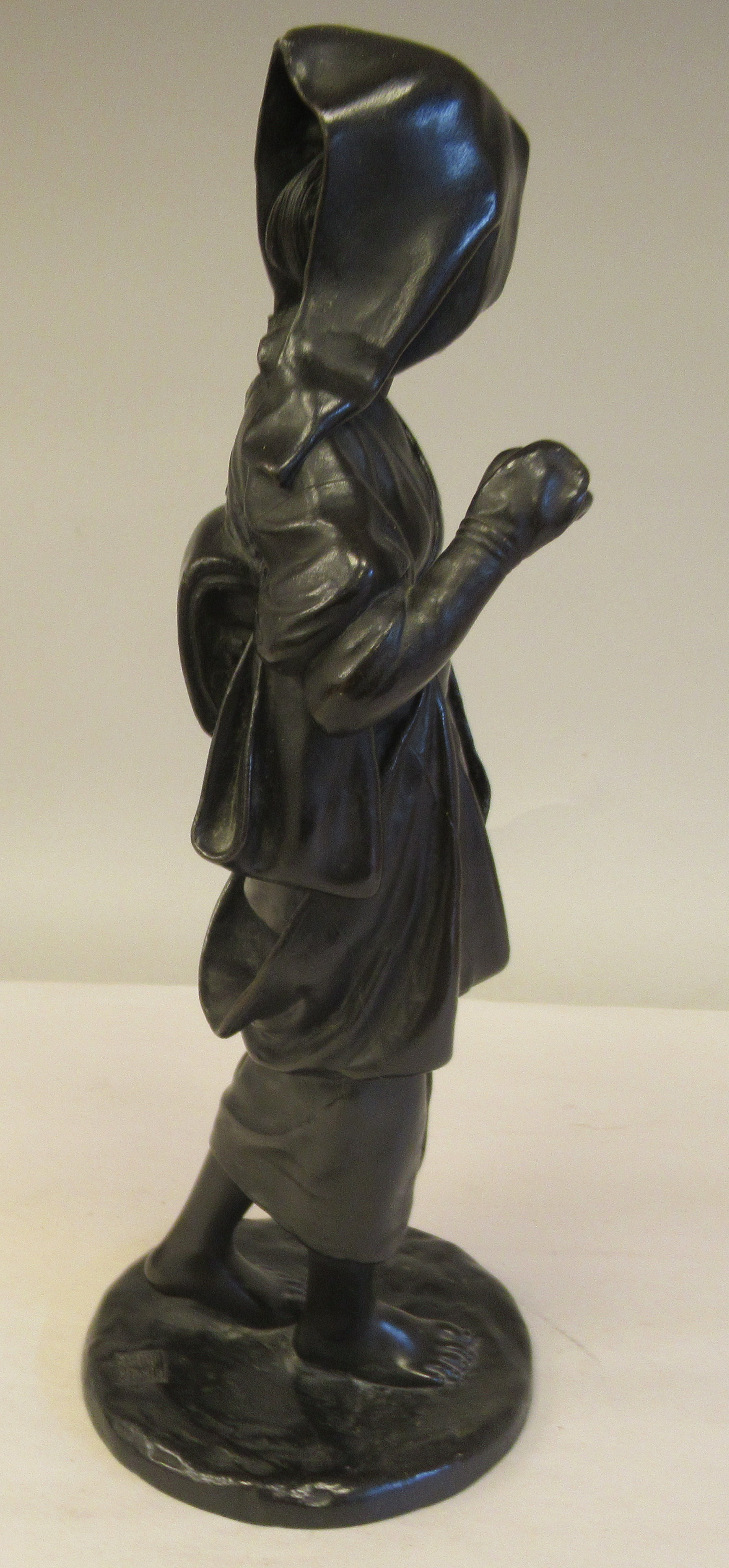 A late 19thC cast and patinated bronze figure, a young woman wearing traditional dress, walking with - Image 6 of 6