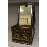 An early 20thC Japanese twin handled hardwood vanity box with decorative rivetted brass