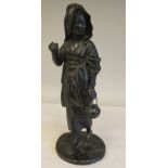 A late 19thC cast and patinated bronze figure, a young woman wearing traditional dress, walking with