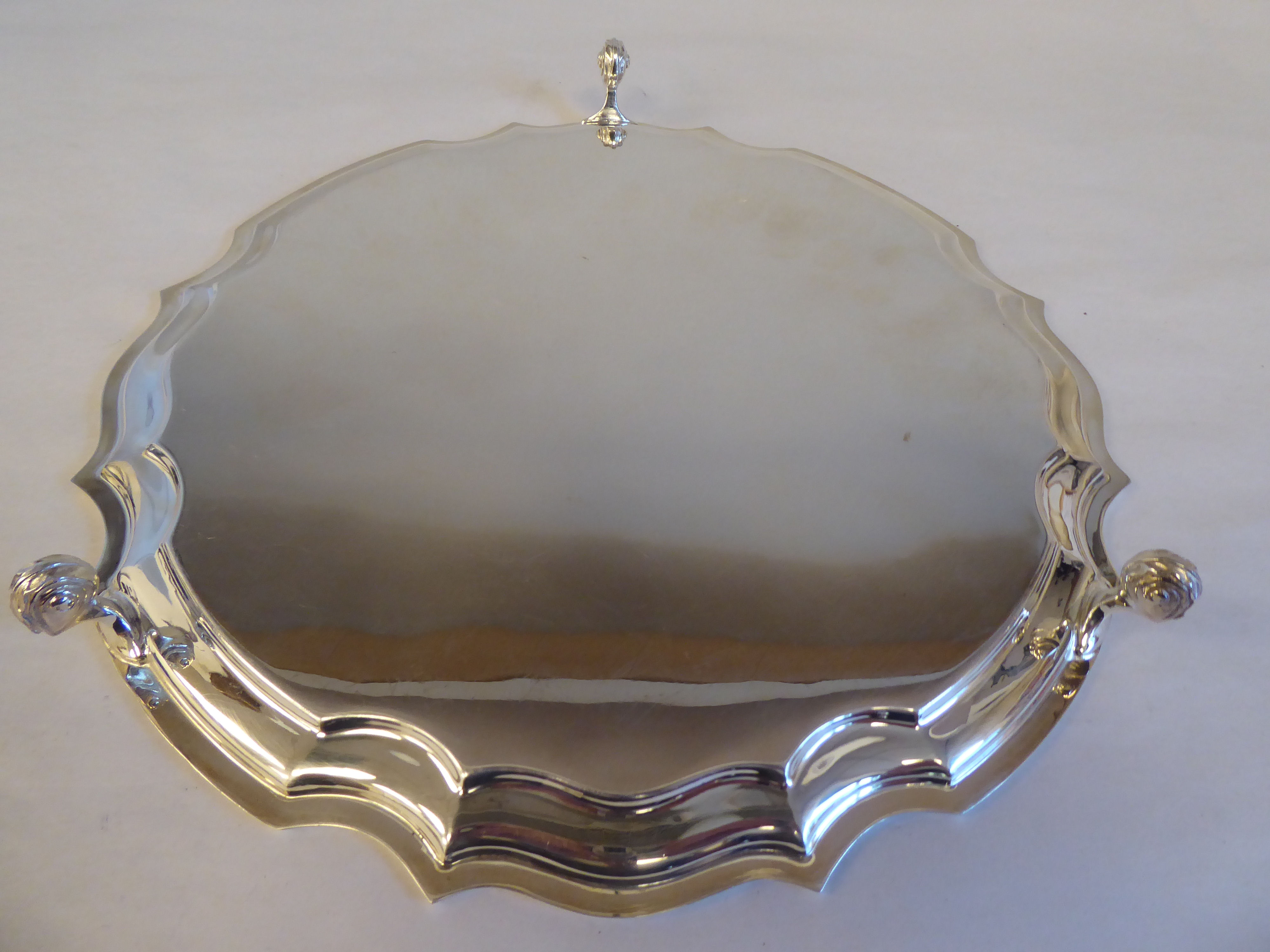 A modern Georgian style silver salver with a raised piecrust border, elevated on slender feet  bears - Image 4 of 4