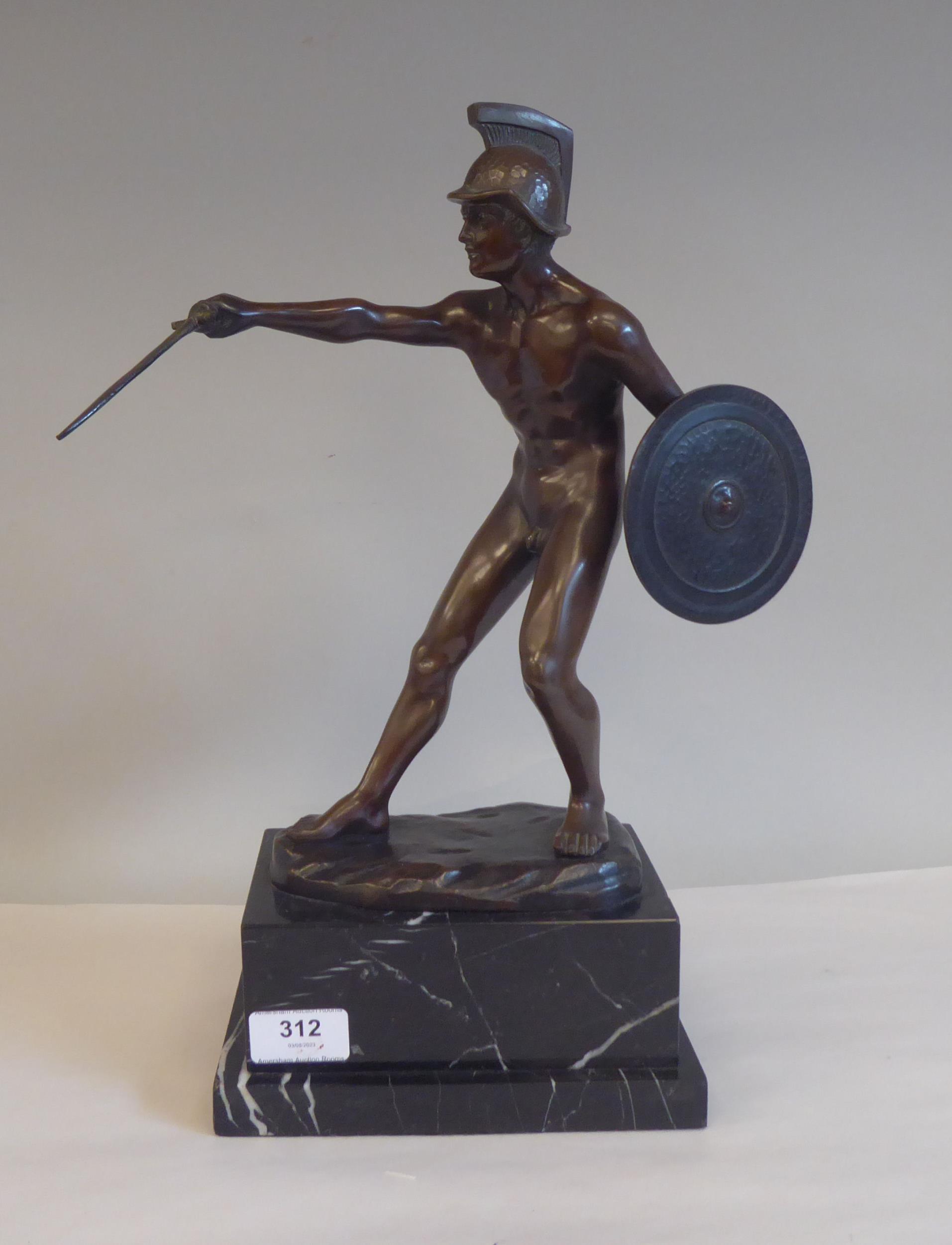 After Schwaldenberg - a cast and patinated bronze nude, classical warrior with a shield and sword