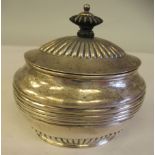 A late Victorian silver oval, demi-reeded caddy with an outset hinged lid and bone finial  Henry