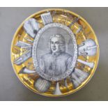 An Italian Grandi Maestri Fornasetti, Alessandro Scarlatte porcelain portrait plate, featuring a