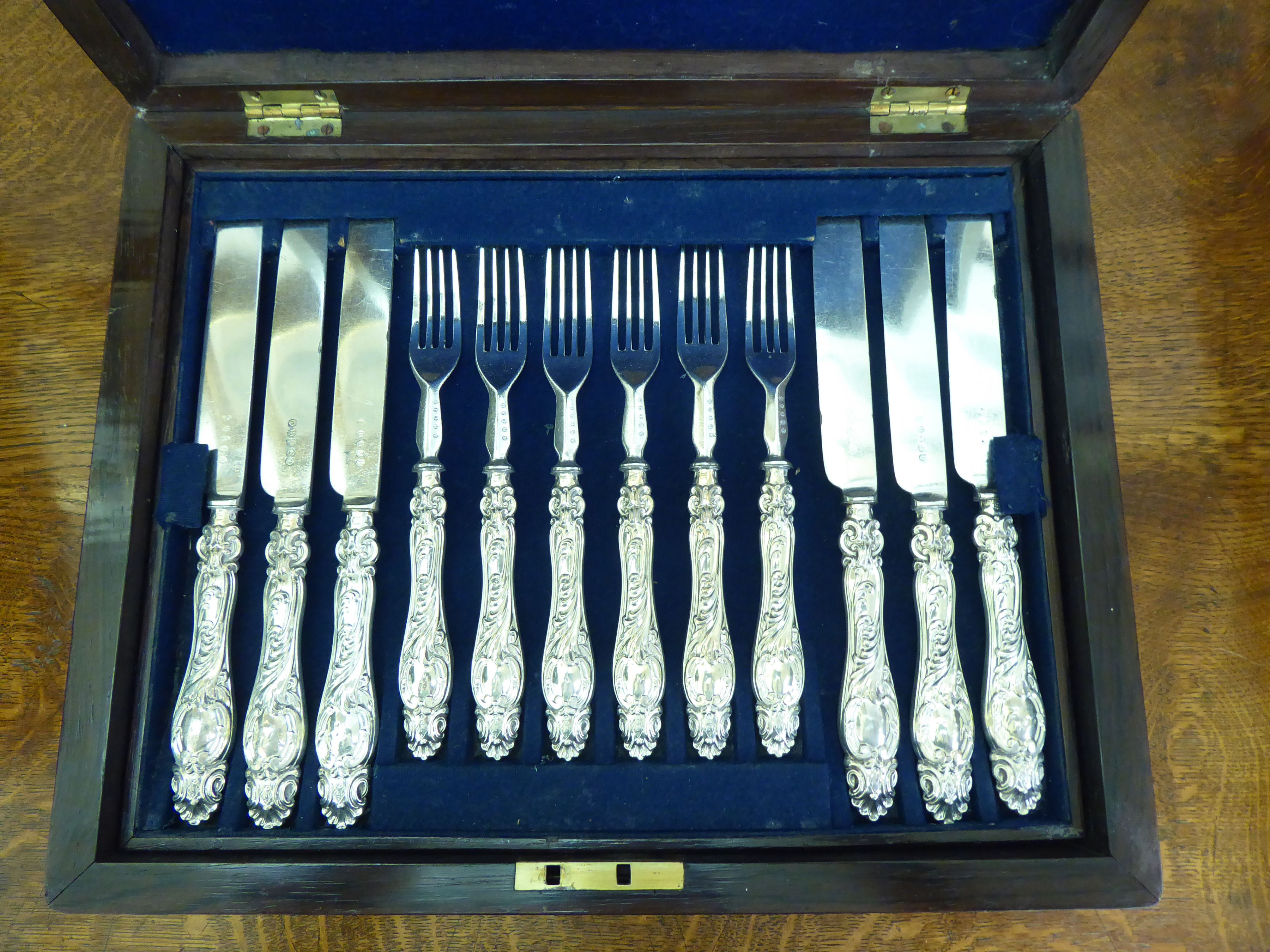 A set of eighteen Victorian silver plated fruit knives and forks, on scroll moulded silver handles - Image 3 of 4