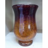 A Monart speckled glass vase of waisted, baluster form, decorated in tones of burnt orange and brown