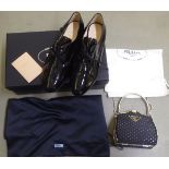 A pair of lady's patent laced pumps  size 35.5  boxed; and a matching evening bag