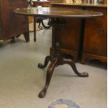 A George III mahogany pedestal table, over a birdcage, turned, bulbous column, raised on a tripod