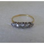 An 18ct gold, claw set, five stone diamond ring