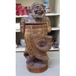 A late 19th/early 20thC Sino-European carved and stained jar and cover, depicting a standing,