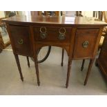 A George III mahogany bow front three drawer, kneehole sideboard, raised on ring turned legs  36"