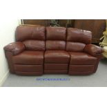 A modular three piece, three person brown hide settee with reclining end sections  81"w