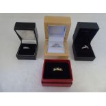 Four variously set 9ct gold rings