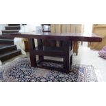 A modern hardwood hall table, the planked top raised on a block underframe  34"h  75"w