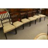 A harlequin set of six Regency mahogany framed bar back dining chairs, the later fabric