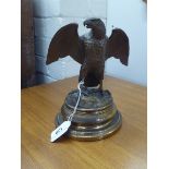 A mid 20thC novelty, cast brass inkwell, fashioned as an eagle, on a plinth  7.5"h overall