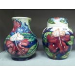 Moorcroft pottery, viz. a Simeon pattern ginger jar and cover  6.5"h; and a Simeon pattern vase  6.