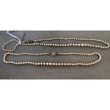 Two similar vintage graduated pearl necklace