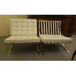 A pair of Barcelona style chairs with stitched, button upholstered cream hide cushioned back and