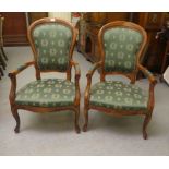 A pair of modern Victorian style stained beech framed open arm salon chairs, the back and seats