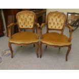 A pair of modern 19thC French inspired beech framed, open arm salon chairs, upholstered in old