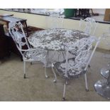 A 20thC white painted cast metal terrace table  28"h  39"dia; and a matching set of four terrace