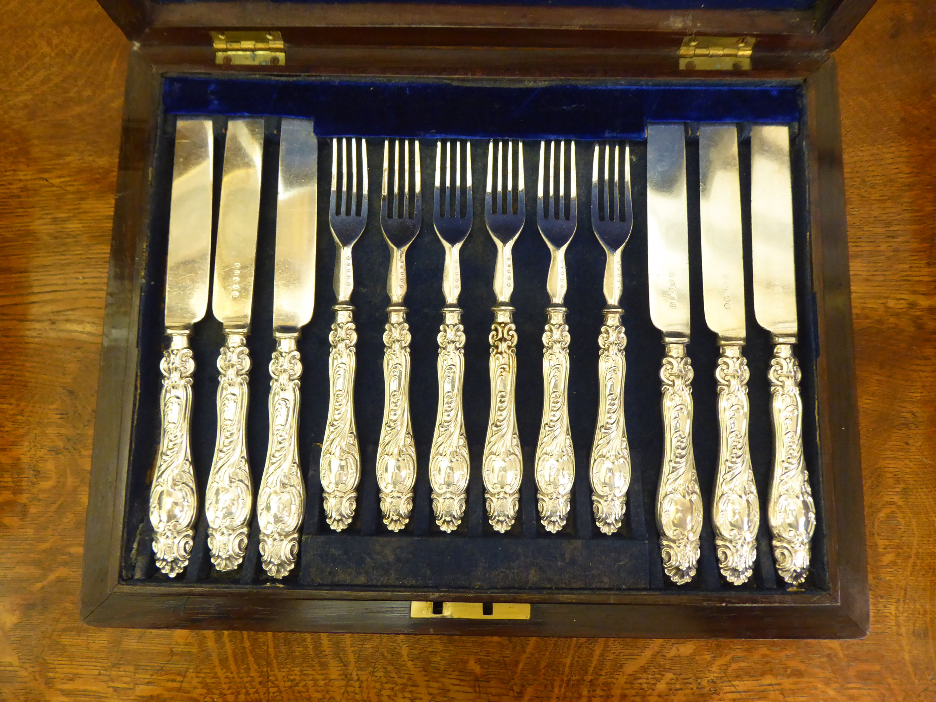 A set of eighteen Victorian silver plated fruit knives and forks, on scroll moulded silver handles - Image 2 of 4