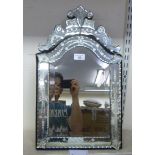 A modern Venetian design mirror with a multi-panelled engraved plates  20" x 12"