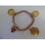 A 9ct gold charm bracelet with a 9ct gold lock and three half-sovereigns, St George on the