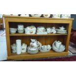 A modern oak open front single shelved bookcase, on a plinth  34"h  53"w