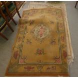 Four dissimilar Chinese washed woollen rugs, each decorated in individual designs  largest 48" x 76"