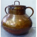 An antique, probably North African, twin handled bulbous vessel with a rivetted lid  18"h