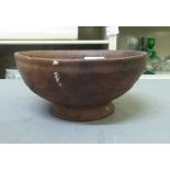 An antique Chinese earthenware bowl with incised frieze decoration, on a splayed footrim  7"dia