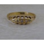 An 18ct gold and diamond set gypsy style ring