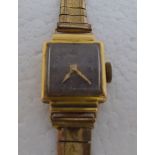 A lady's 18ct gold cased Ardan wristwatch, the square face set with an Arabic dial