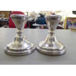 A pair of silver dwarf candlesticks, each with a Celtic design sconce  Birmingham marks rubbed  4"h
