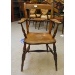 A mid 19thC beech and elm framed Windsor chair with a bar back and horizontal splat, open arms and a
