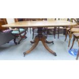 An early 19thC mahogany breakfast table, the tip-top over a turned column, raised on a splayed