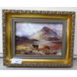 J Skerrett - cattle drinking from a river, in a mountainous landscape  watercolour on porcelain