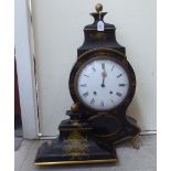 A 19thC black lacquered and gilt painted mantel clock of waisted, bulbous form with a spherical