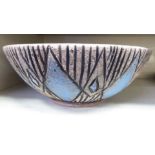 A Tilgmans Keramik of Sweden studio pottery fruit bowl, decorated with fish and impressed, repeating