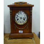 A mid 20thC walnut cased mantel clock with gilt metal mounts; the 8 day movement faced by an