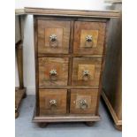 A modern fruitwood and marquetry chest with six short drawers, raised on turned, bun feet  30"h