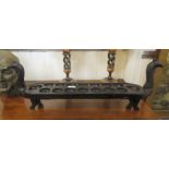 A 20thC stained and carved hardwood South East Asia Mancala Dakon/Congkak games board  28"w